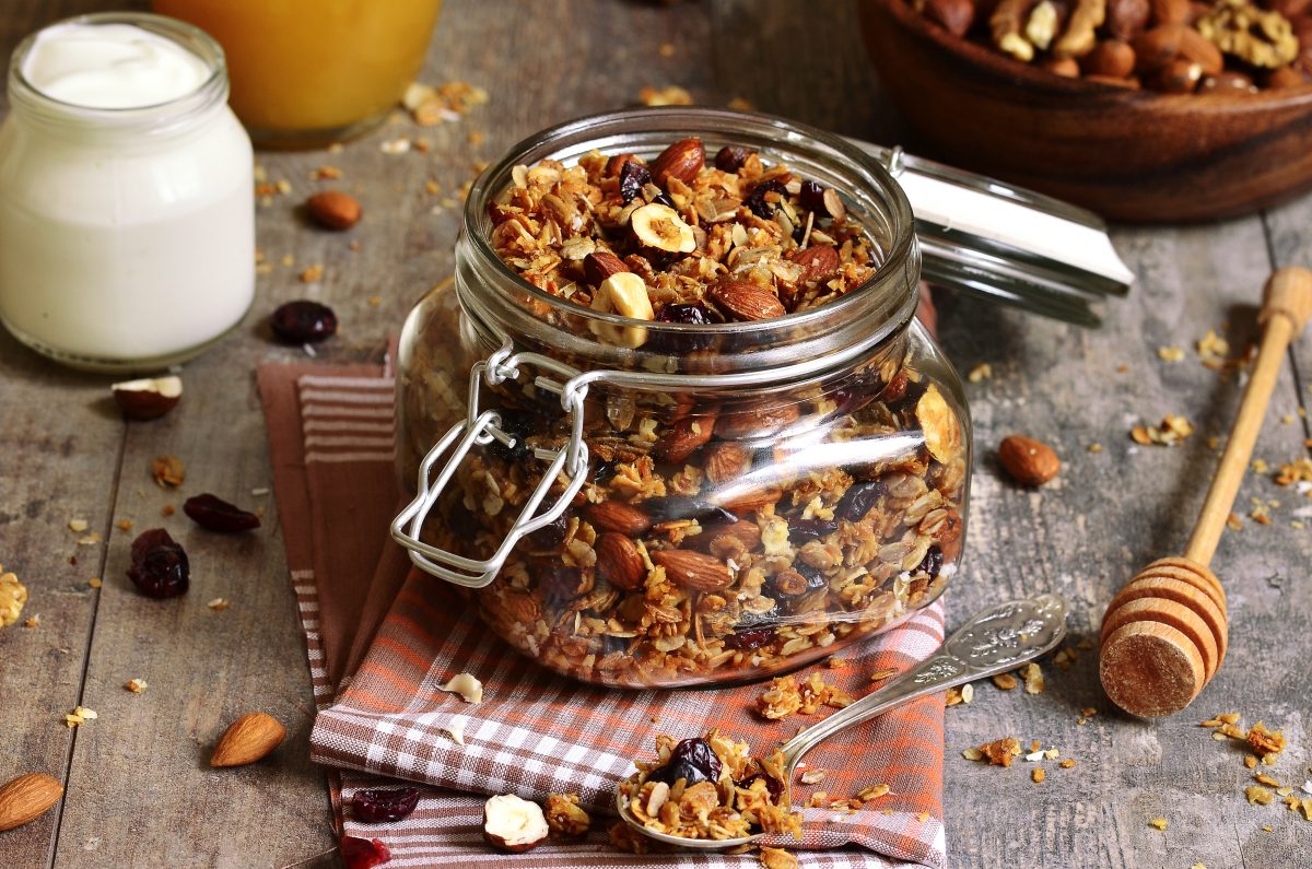Granola from several types of cereals with nuts,coconut chips and dried cranberry.